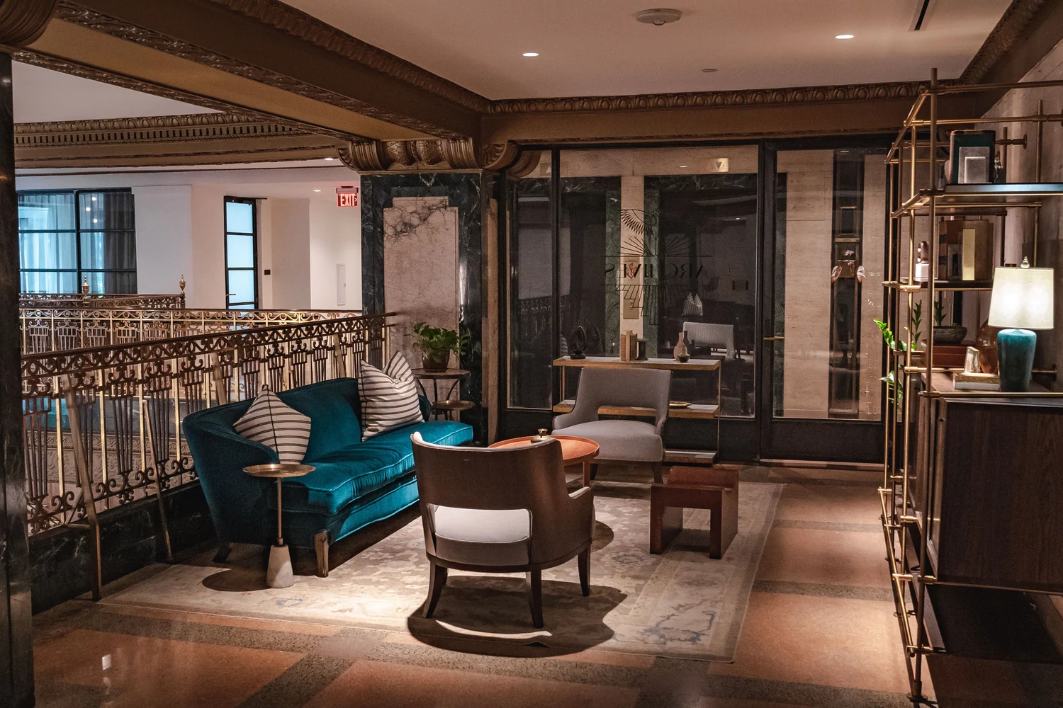 Sophisticated hotel seating area with velvet furniture