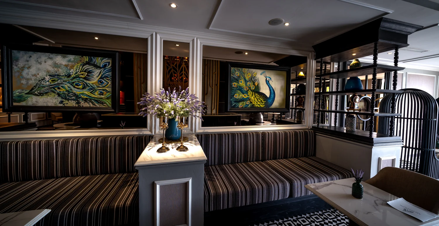 Ornate hotel lobby decor with artistic paintings